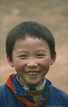 CHINA, Hunan Province, Children, Portrait of smiling young boy. Member of the Young Pioneers.