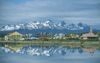 ARGENTINA, Patagonia, Tierra del Fuego, "Ushuaia, view of town with snowcapped mountains of Chile