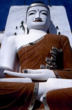 MYANMAR, Yangon, Kyaikpun, Angled view looking up at seated Buddha statue dating from 1746