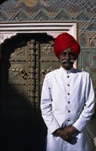 INDIA, Rajasthan  , Jaipur, Palace guard wearing white with red turban