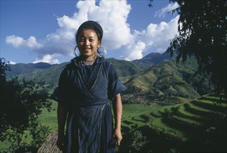 VIETNAM, North, Sapa, Young Muong woman in rural area.  Three-quarter portrait.