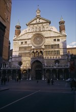 ITALY, Emilia Romagna , Cremona, "Il Duomo exterior facade with people, children and pigeons in