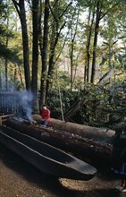 USA, North Carolina, Building, "Making dug out canoe, Oconaluftee Indian village. Cherokee