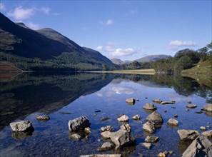 ENGLAND, Cumbria, Lake District, "Buttermere.  Landscape, blue sky and drifting cloud reflected in