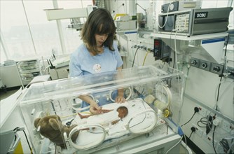 HEALTH,  , Babies, Special Care Baby Unit with tiny baby in an incubator with attending nurse