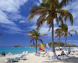 WEST INDIES, Antigua, "Deep Bay.  Sandy beach with sailing boats, sunbeds and palm trees. "