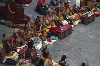 TIBET, People, Men, Monks chanting during Buddhist ceremony.