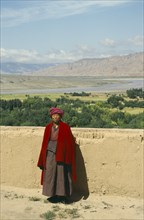 CHINA, Quinghai Province, Tibetan monk living in remote area by the Yellow River near Guide.