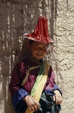 CHINA,  , Qinghai, Young Tibetan boy dressed in festival dancing costume