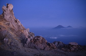 INDONESIA, Java, Mount Merapi, View from the rocky summit of the volcano with peaks in the distance
