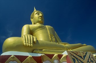 THAILAND, Surat Thani, Koh Samui , Seated golden Buddha at the Big Buddha Temple.