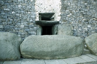 EIRE, County Meath, Newgrange, Entrance to Prehistoric Burial Site in the Boyne Valley with carved