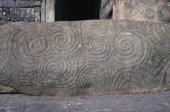 IRELAND, County Meath, Boyne Valley , Newgrange world heritage site. Carved stone at entrance of