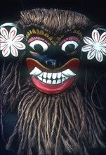 SRI LANKA, Bentota, Close up of carved mask with coir hair