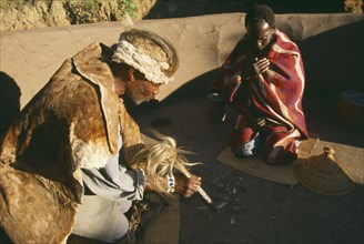 SOUTH AFRICA, Qwa-Qwa, Basotho Village, Basotho Cultural Village.  Local man consulting a Diviner