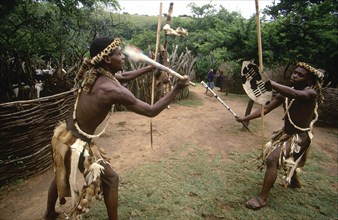 SOUTH AFRICA, KwaZulu Natal , Melmoth, Zulu men demonstrating traditional fighting with sticks