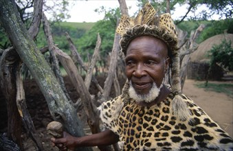 SOUTH AFRICA, KwaZulu Natal, Old Zulu man wearing leopard skin.