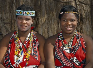 SWAZILAND, Tribal Peoples, Local women in traditional tribal dress and head bands.