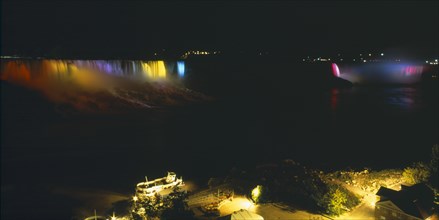CANADA, Ontario  , Niagara Falls, American & Horseshoe Falls illuminated multi-coloured lights