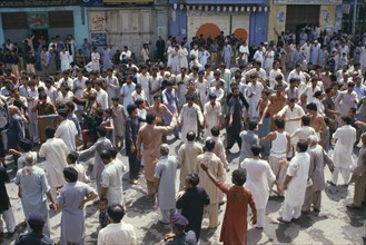 PAKISTAN, N W Frontier Province, Peshawar , "Mohurrum Festival.  Men beating their chests durring
