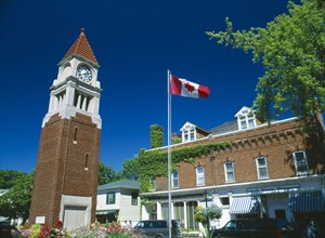 CANADA, Ontario , Niagara on the Lake, Queen Street Clock Tower and Flag.