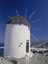 GREECE, Cyclades Islands, Mykonos, Thatched and whitewashed harbour windmill now a folk museum