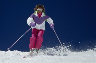 USA, Colorado, Vail, Lone woman skis towards camera