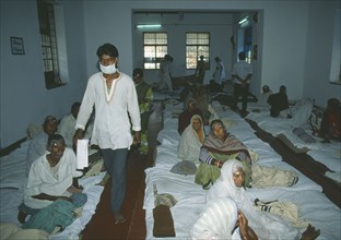 INDIA, West Bengal, Calcutta, Cataract camp with man wearing surgical mask