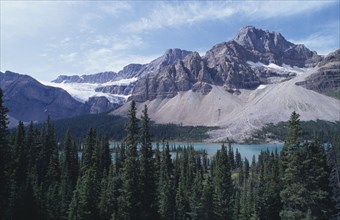 CANADA, Alberta, View towards trees and mountains in Baniff National Park.