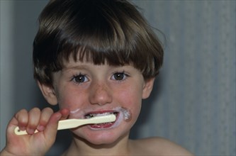 HEALTH, Dental Hygiene, Boy brushing his teeth.