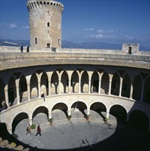 SPAIN, Balearic Islands, Majorca, Palma. View over Bellver Castle courtyard Mountains in distance