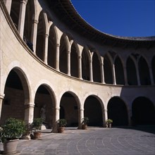 SPAIN, Balearic Islands, Majorca, Palma. Empty Bellver Castle inner courtyard with arches and