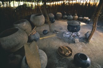 SOUTH AFRICA, KwaZulu-Natal , Melmoth, Simunye Lodge.  Interior of beer making hut with large