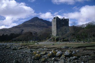 SCOTLAND, Argyll and Bute, Isle of Mull, "Moy Castle on the shores of Loch Bui, mountain peak