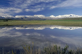 SOUTH AFRICA, Western Cape, Ceres, Landscape with snow covered mountains reflected in dam in the