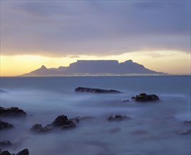 SOUTH AFRICA, Cape Province, Cape Town, View of Table Mountain at dawn taken from Bloubergstrand