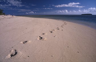 PACIFIC ISLANDS, Fiji, Caqelai Island, Footprints in the sand leading out in to the distance on a