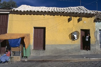 BOLIVIA, Potosi, House with telephone & stall in front