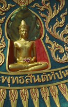 THAILAND, Surat Thani, Koh Samui, Small golden seated Buddha at the Big Buddha Temple on the north