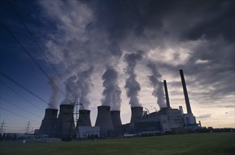 INDUSTRY, Power, Power Station, Cooling towers with steam rising silhouetted against an evening sky