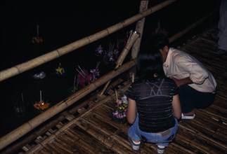 THAILAND, North, Chiang-Mai , "'Yipeng' Loi Krathong Festival, Lighting candles on Krathong to be