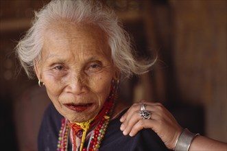 THAILAND, North, Chang Ria, Portrait of an elderly Karen Refugee woman with a younger womans hand