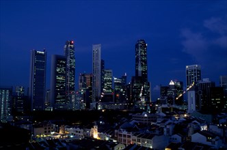SINGAPORE, Raffles Place, City skyline illuminated at night