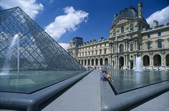 FRANCE, Ile De France , Paris, The Louvre art gallery with a part of the Pyramid and fountains in