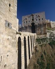 SYRIA, Aleppo,   Halab, "The Citadel, stone, fortified, arched viaduct walk to entrance "