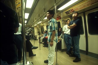 SINGAPORE, Transport, Passengers standing in MRT Mass Rapid Transport train carriage