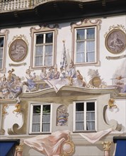 GERMANY, Bavaria, Oberammergau, Close up of Bavarian wall paintings around the windows of a