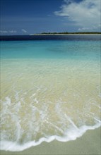 INDONESIA, Lombok, Gili Islands, Gili Trawangan looking towards Gili Meno with gentle waves