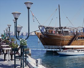 UAE, Abu Dhabi, Corniche. Restaurant Dhow by seam moored boats
