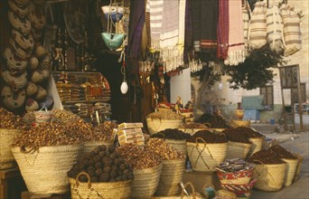 EGYPT,  , Luxor, Date and souvenir shop with straw baskets on pavement